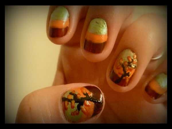 Ongles marron, orange et vert avec des arbres