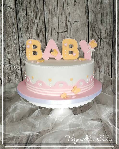 Gâteau simple avec une décoration de gâteau pour bébé lumineuse