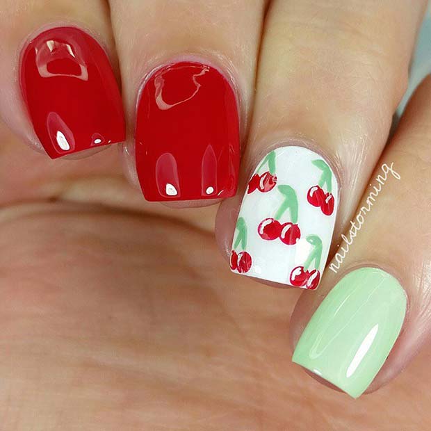 Conception d'ongles rouges, blancs et verts