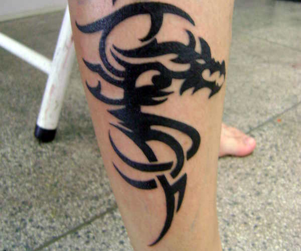 Tribal Dragon Leg Tattoo