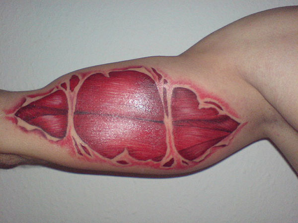 Muscle Rip Arm Tattoo