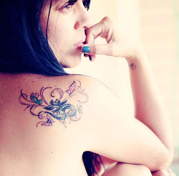 Woman's Om Tattoo
