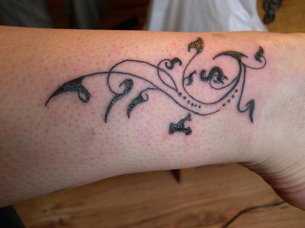 Tatouage cheville droite