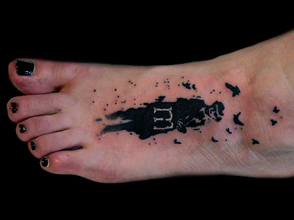 Tatouage de pied fascinant