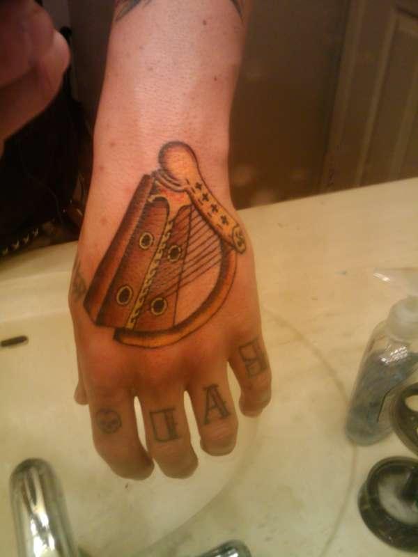 Harp Hand Tattoo