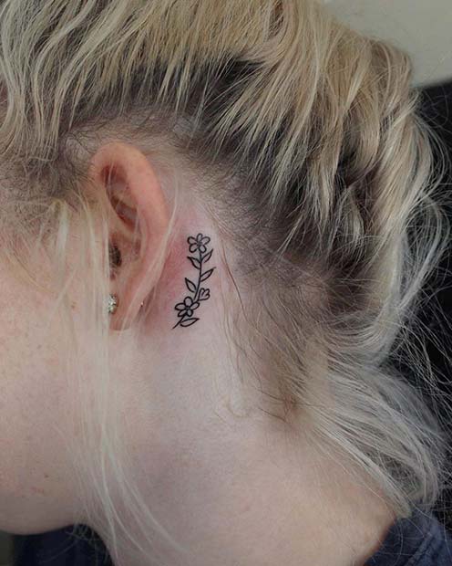 Conception de tatouage élégante derrière l'oreille