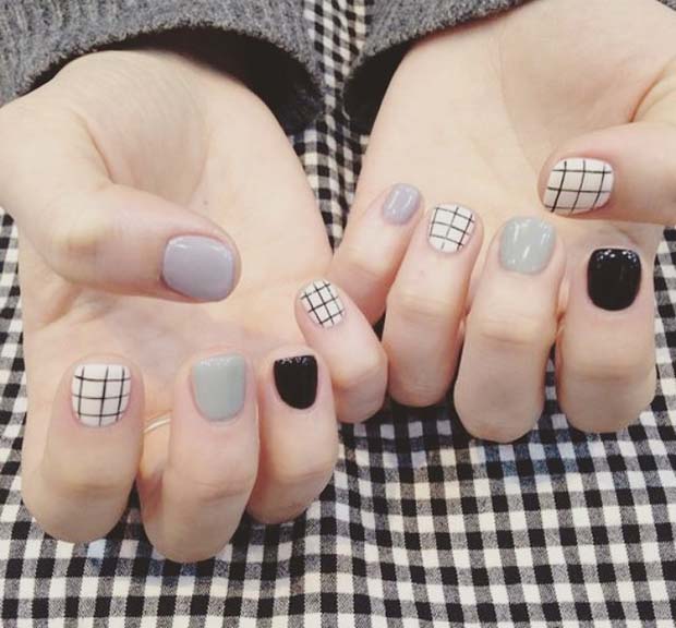 Ongles gris, noirs et quadrillés pour des idées d'ongles d'hiver