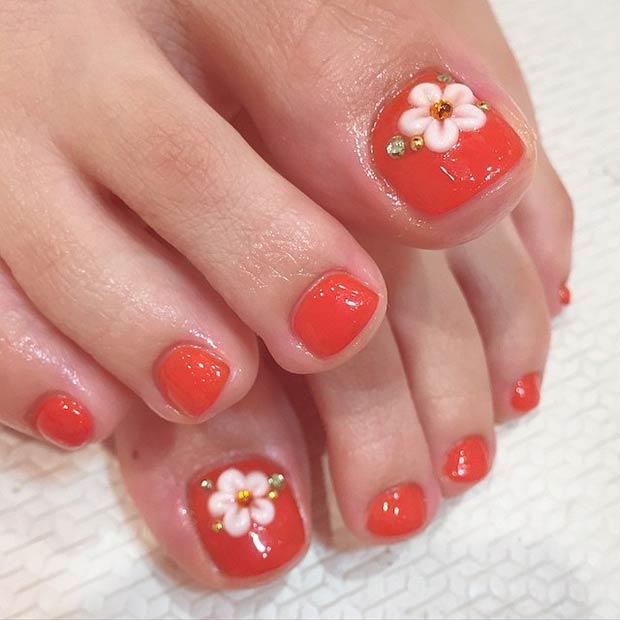 Πορτοκαλιά νύχια με λουλούδια