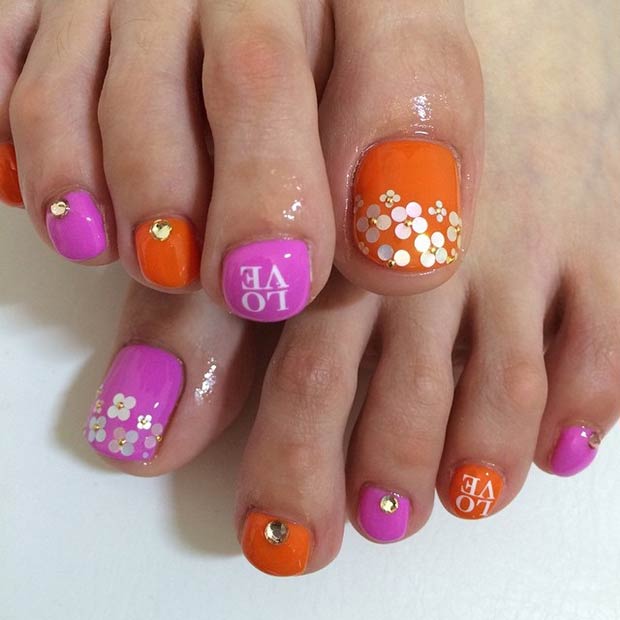 Conception d'ongles d'orteil rose et orange