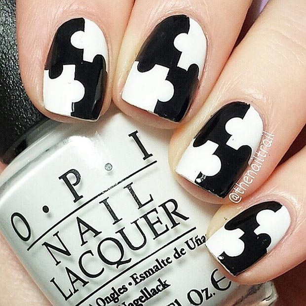 Conception d'ongles de puzzle noir et blanc