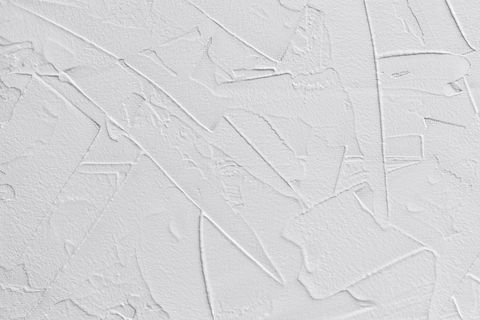 fond abstrait blanc de pâte de remplissage et de plâtre de liaison avec des tirets et des traits irréguliers